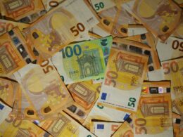 A pile of 50 euro bills sitting on top of each other